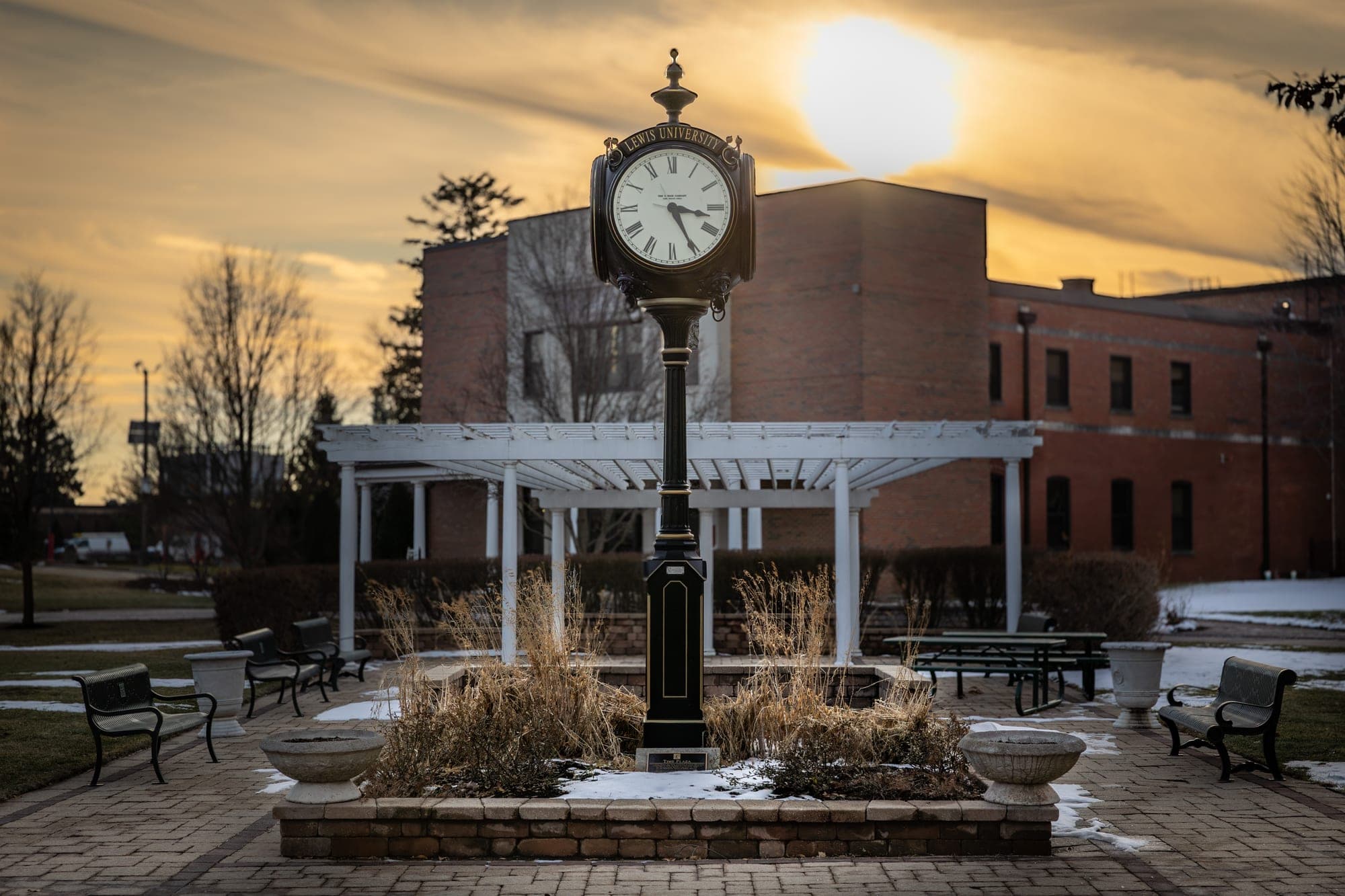 Lewis University campus clock and pergola at sunset