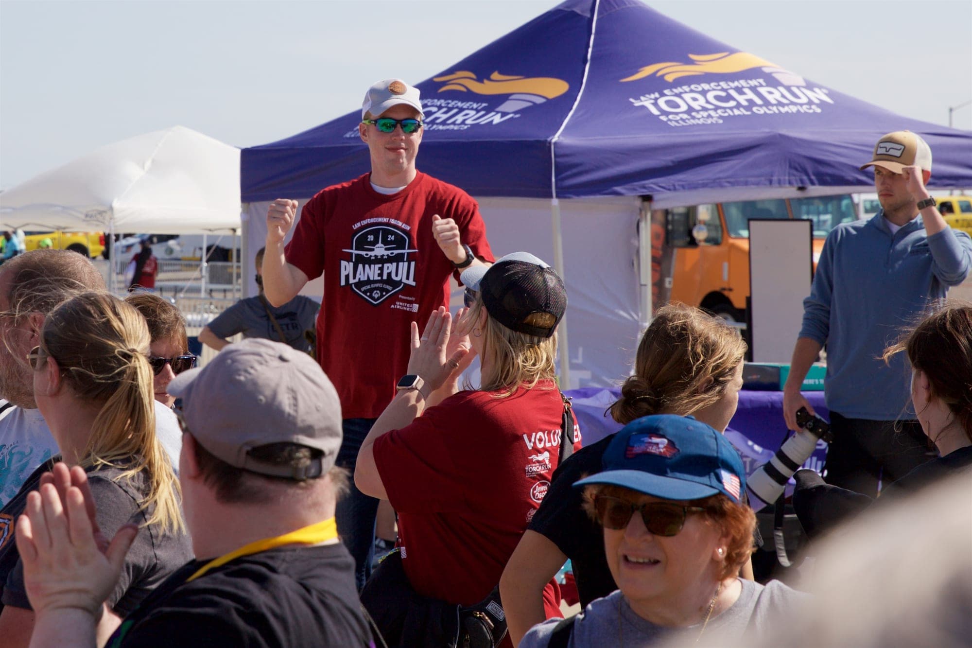 Logan Kap firing up the crowd at the Special Olympics Illinois Plane Pull